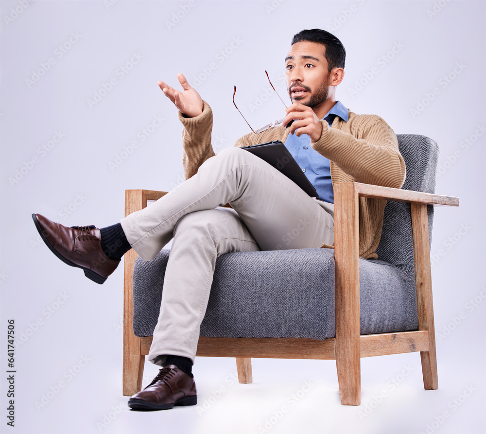 Tablet, explain and a man psychologist in a chair on a white background in studio to listen for diag