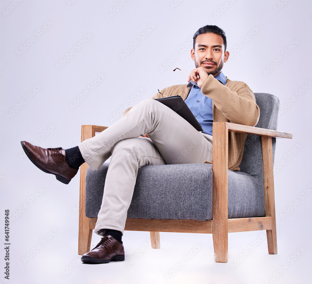 Portrait, tablet and psychology with a man in a chair on white background in studio to listen for di