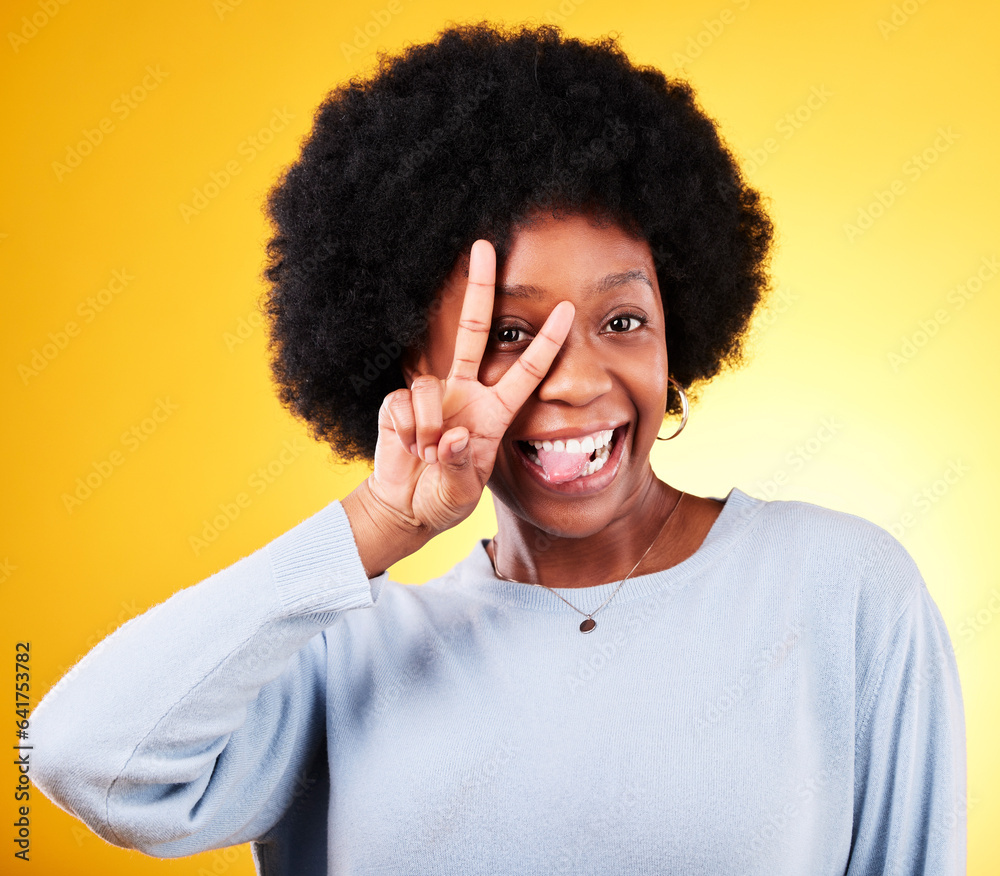 Peace, tongue out and portrait of a woman in studio with fun emoji, silly face and v sign. African p