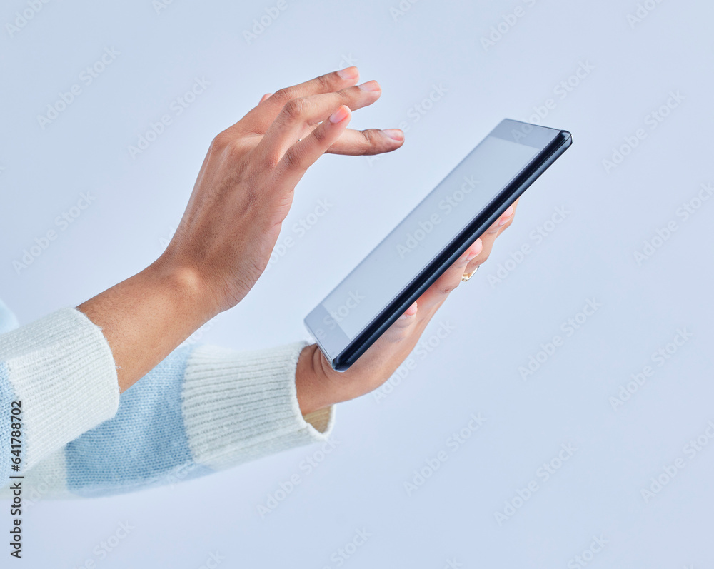 Hands, tablet and person on studio for social media, reading ebook and search website on gray backgr