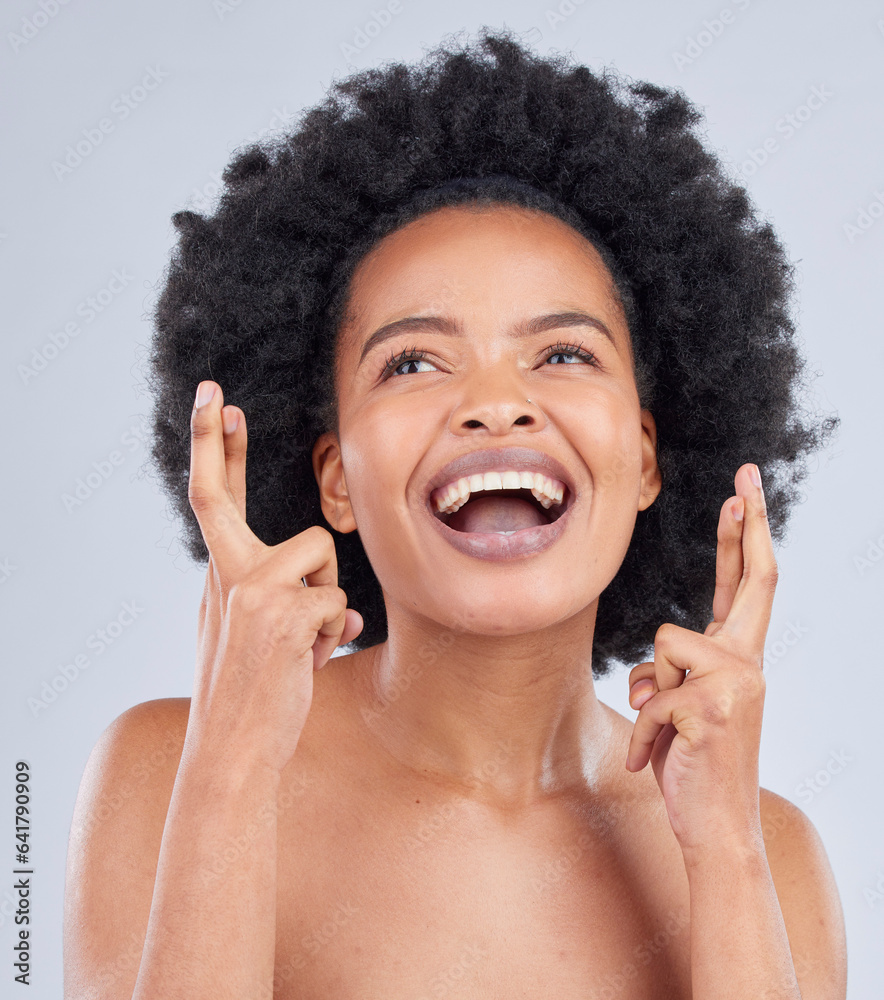 Hope, luck and black woman with fingers crossed for beauty and skincare isolated in a studio gray ba