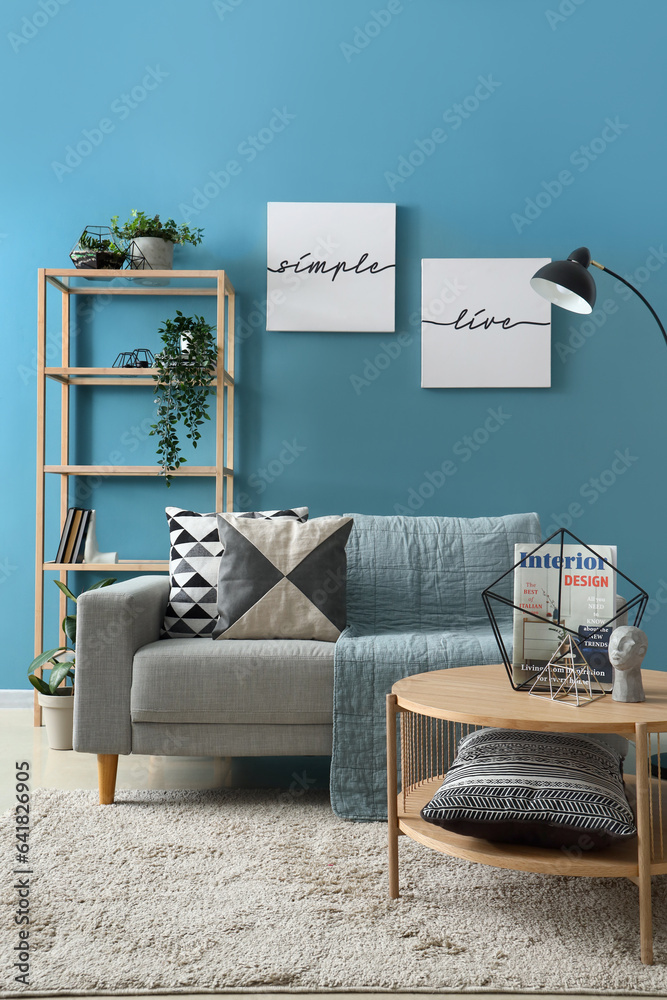 Interior of stylish living room with coffee table and cozy sofa