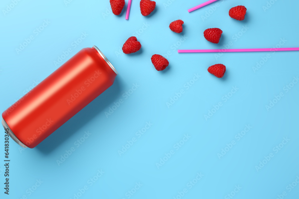 Composition with can of fresh soda and raspberry on blue background