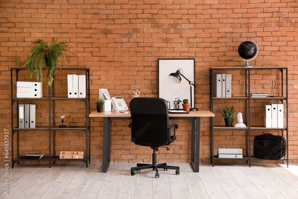 Interior of office with workplace and shelving units