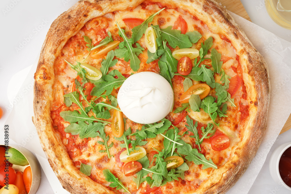 Tasty pizza with Burrata cheese on white background