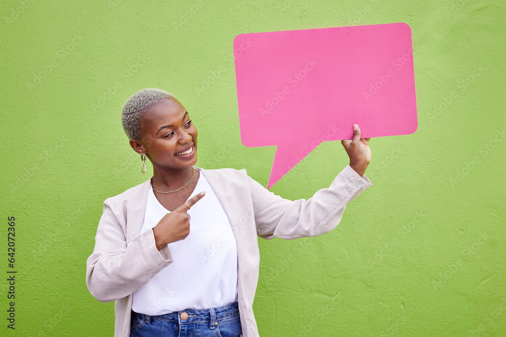 Black woman, speech bubble and thinking for pointing, space or mockup with opinion by green wall bac