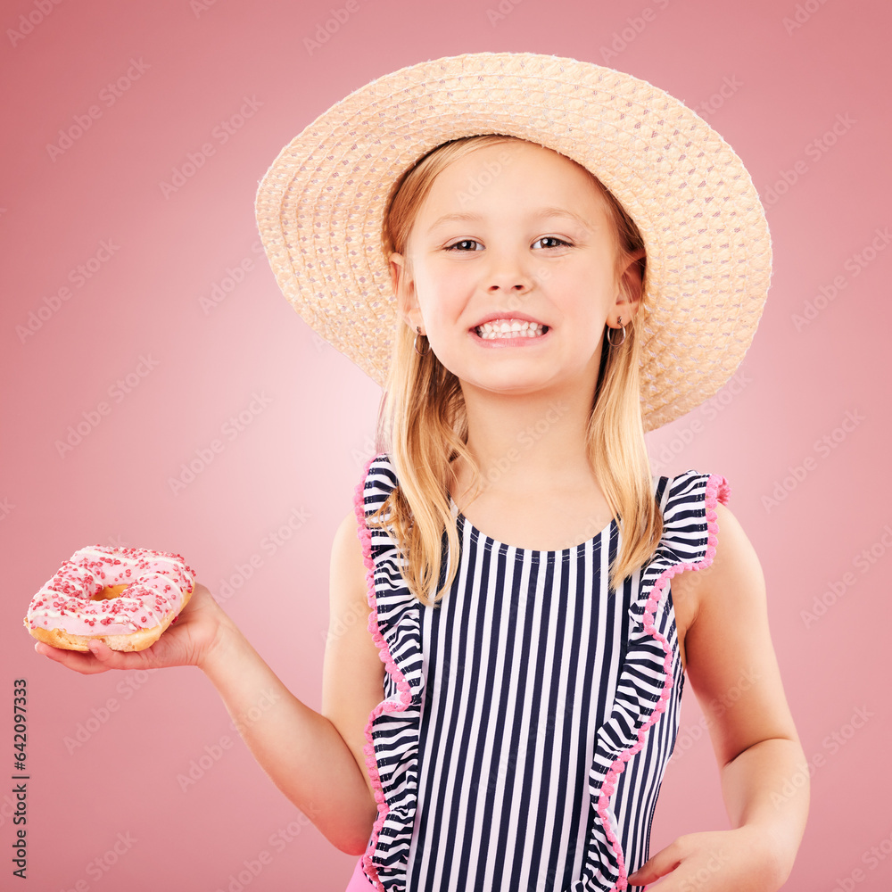 Happy, portrait and girl with a donut or child with sugar, dessert and sweet craving on pink backgro