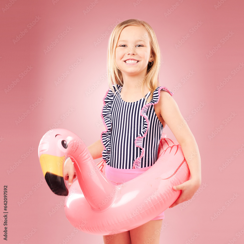 Girl child, summer and swimsuit with inflatable, flamingo and happiness with vacation on pink backgr