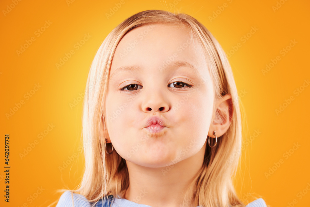 Portrait, kiss and girl child in studio with love, expression or gesture against an orange backgroun