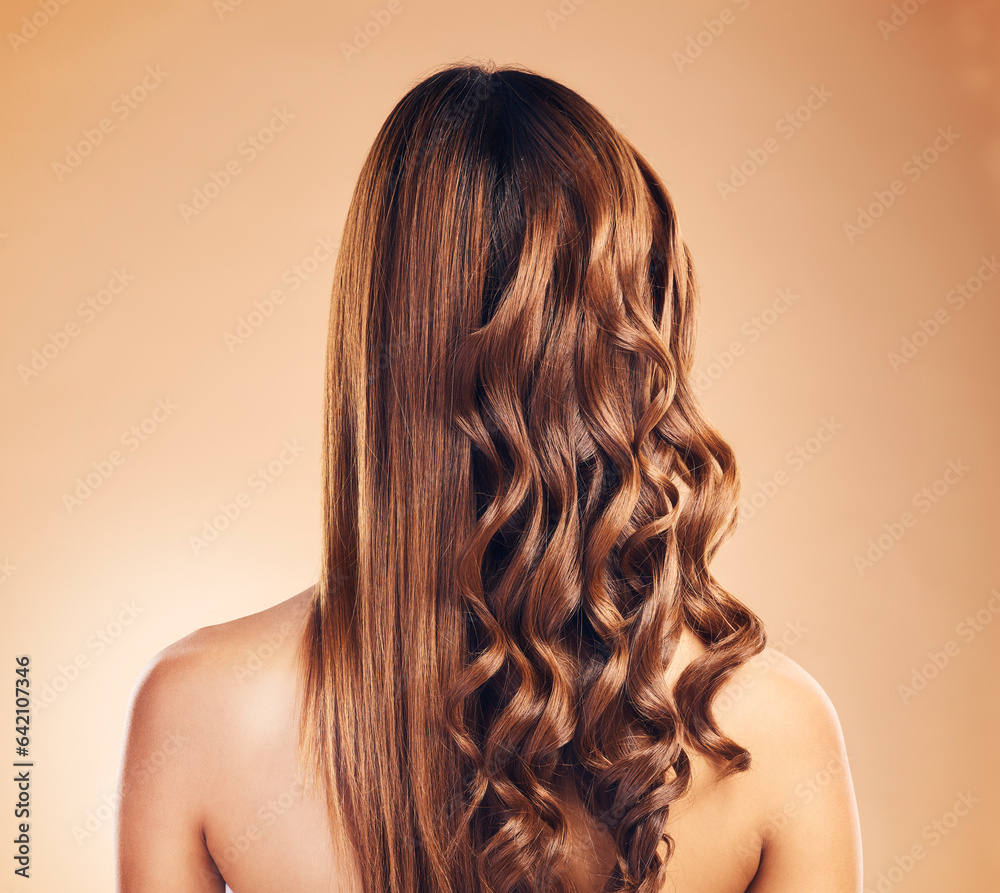 Back view, hair care and curly woman with beauty and strong texture with growth isolated in a studio