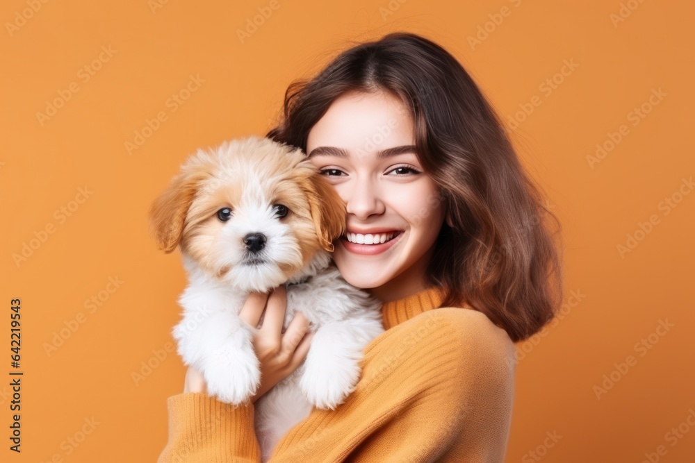 Happy girl with cute little puppy