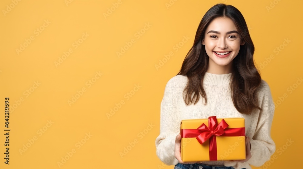 Girl with gift box on vivid background