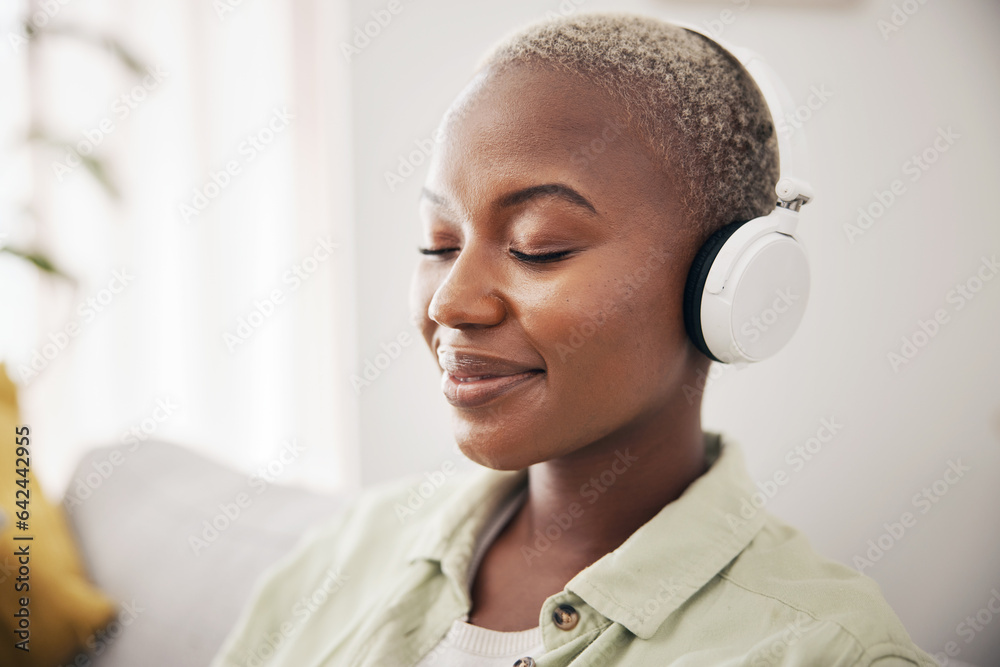 Black woman, listening and meditation podcast on headphones in home, living room or peace on sofa in