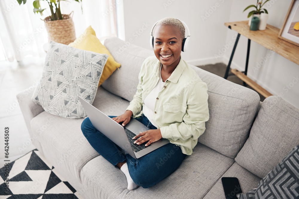 Portrait of black woman, remote work or laptop on sofa in living room for online research in headpho