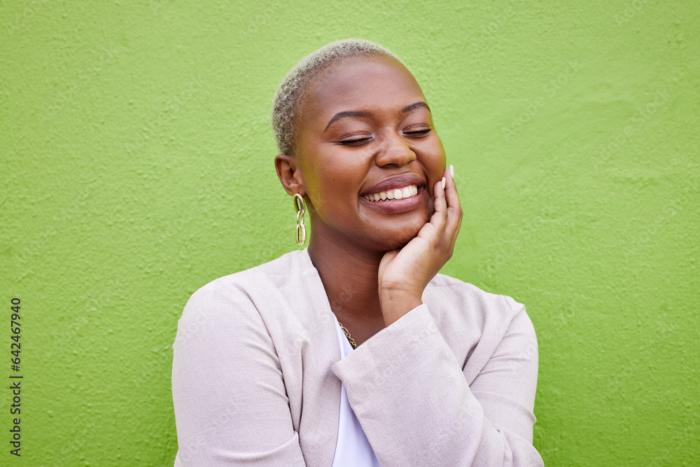 Happy, calm and young black woman by a green wall with trendy, classy and elegant jewelry and outfit