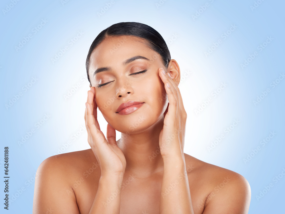 Skincare, makeup and woman with cosmetics, beauty and dermatology on a blue studio background. Welln