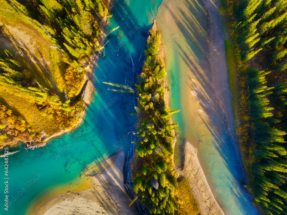 Fall landscape. A drone view of the river in the woods. An aerial view of an autumn forest. Winding 