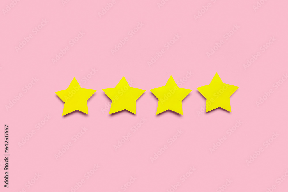 Four stars on pink background. Customer experience concept