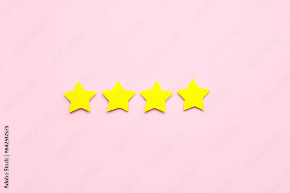 Four stars on pink background. Customer experience concept