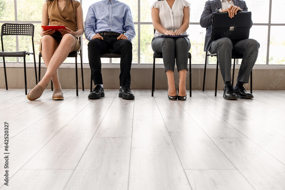 Young people waiting for job interview in office