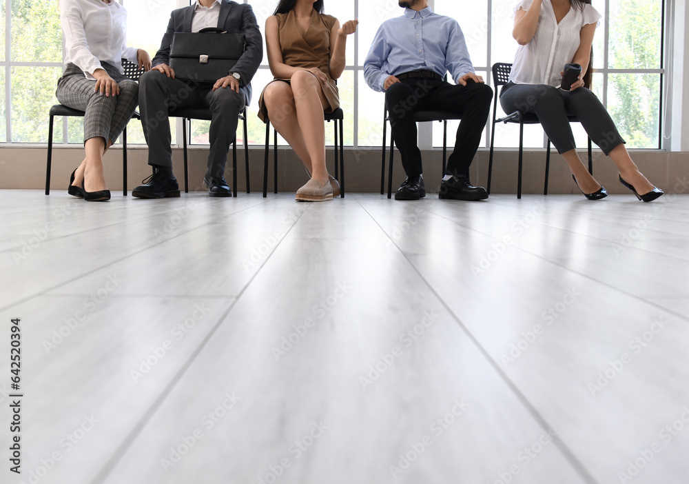 Young people waiting for job interview in office