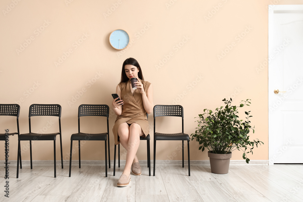 Young woman waiting for job interview in office