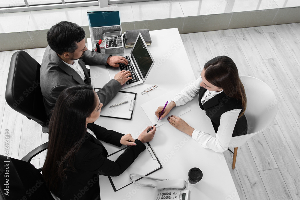 Human resources commission interviewing female applicant in office