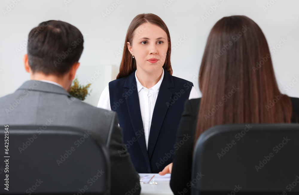 Human resources commission interviewing female applicant in office