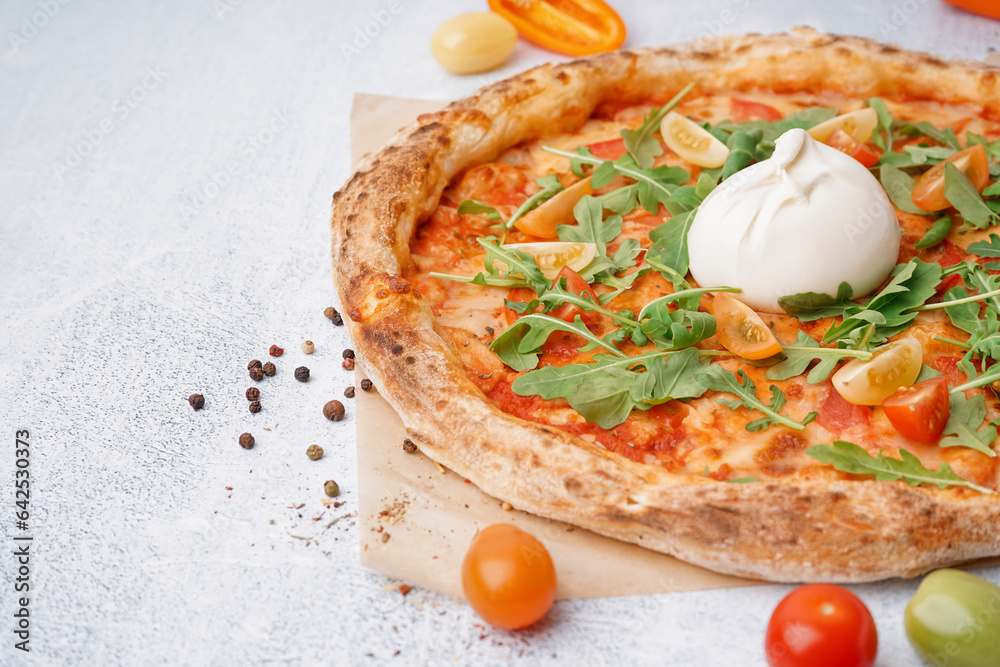 Tasty pizza with Burrata cheese on white background