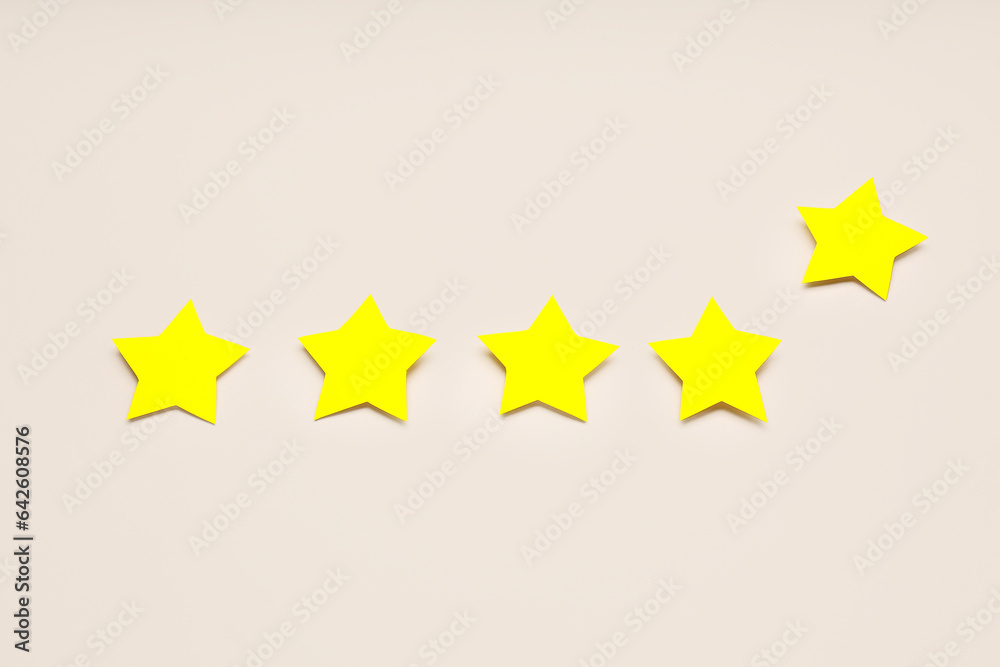 Five stars on light background. Customer experience concept