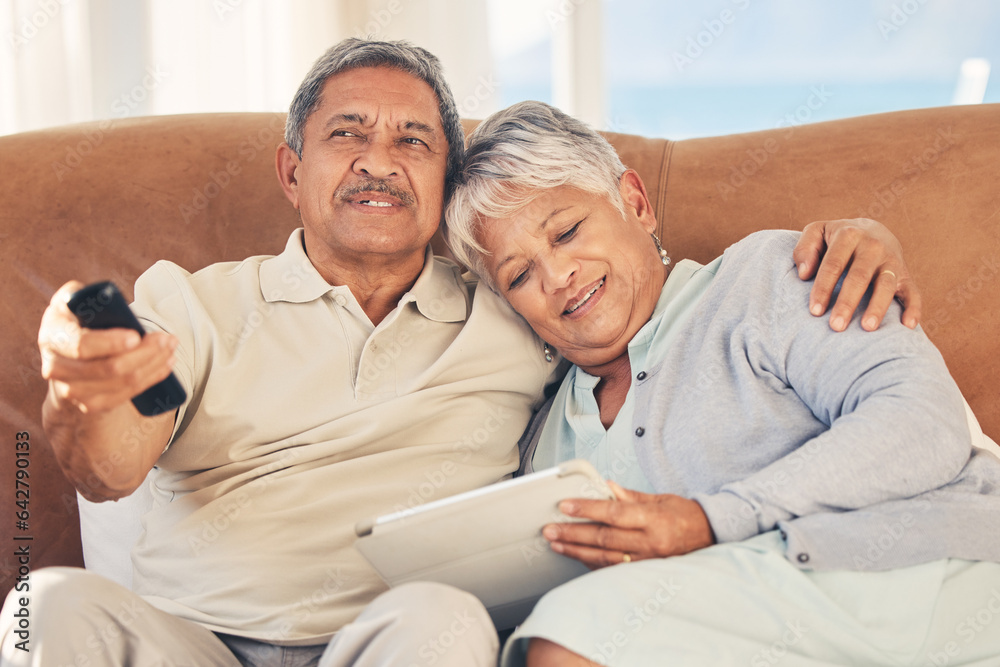 Tablet, TV and senior couple streaming movie or show with love, care and bonding in home living room