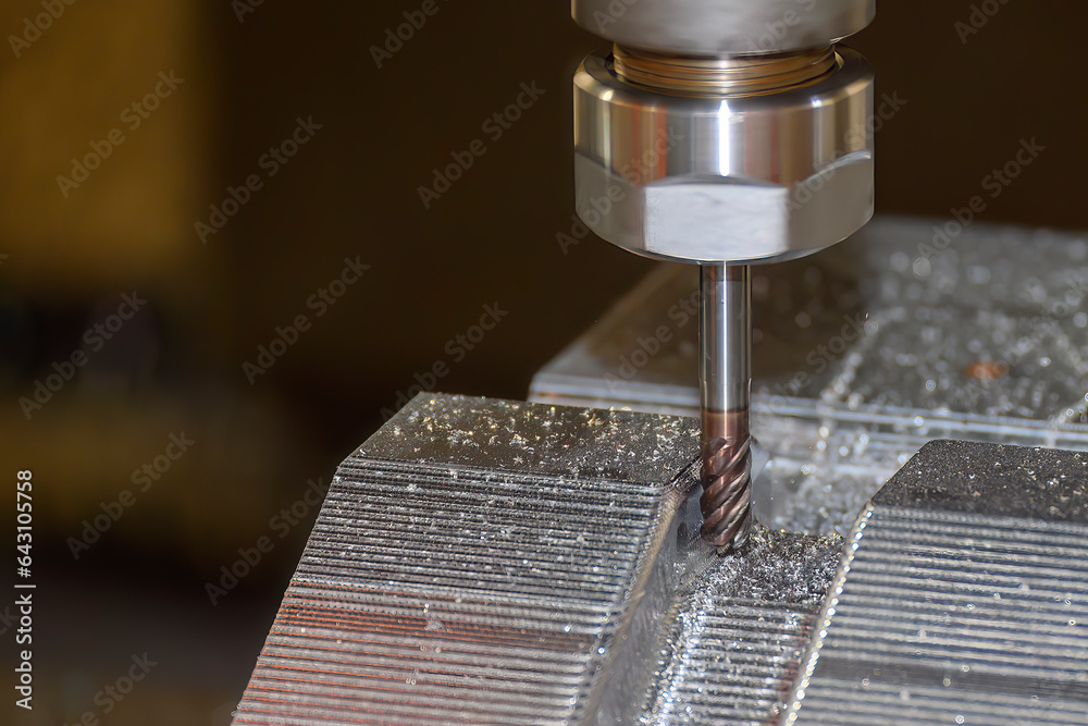 The CNC milling machine cutting press die part by solid bull end mill tool and G-code data backgroun