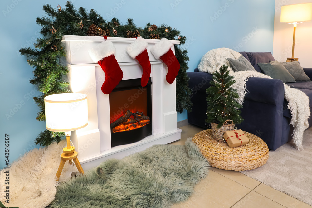 Fireplace with Christmas socks and decorations in living room