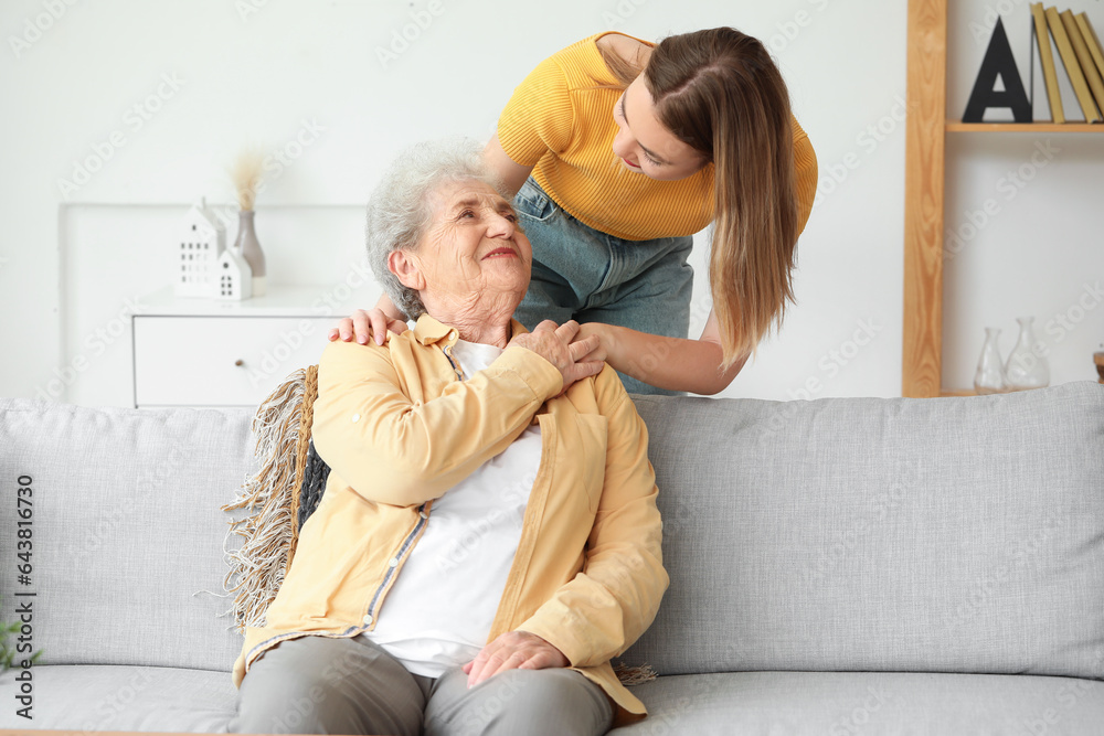 Senior woman with her granddaughter at home