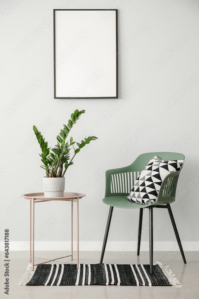 Green plant on table and chair in light room