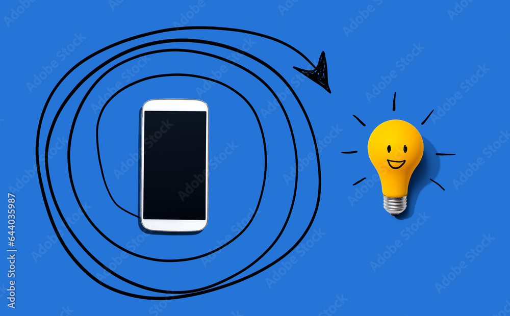 Creativity, inspiration, idea concept with light bulb and smartphone - Flat lay