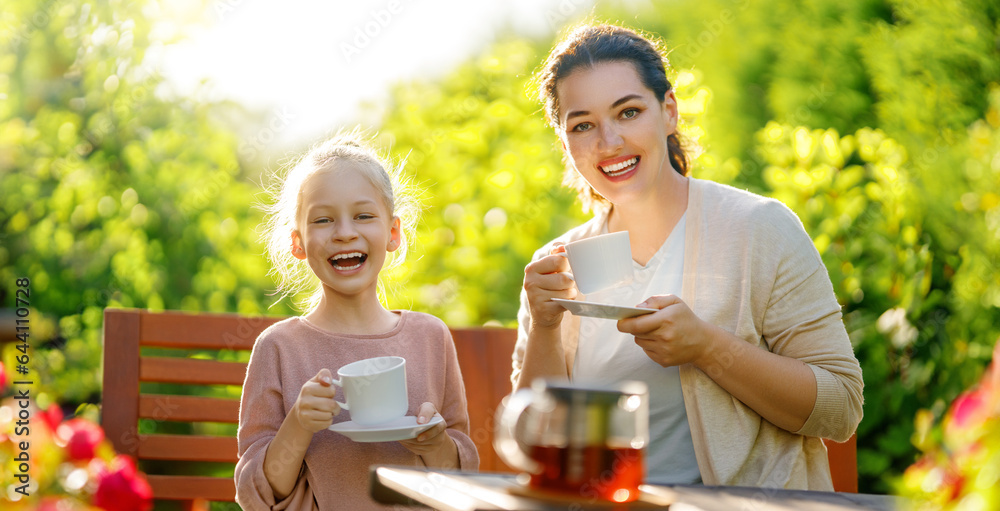 family drinking tea in the garden