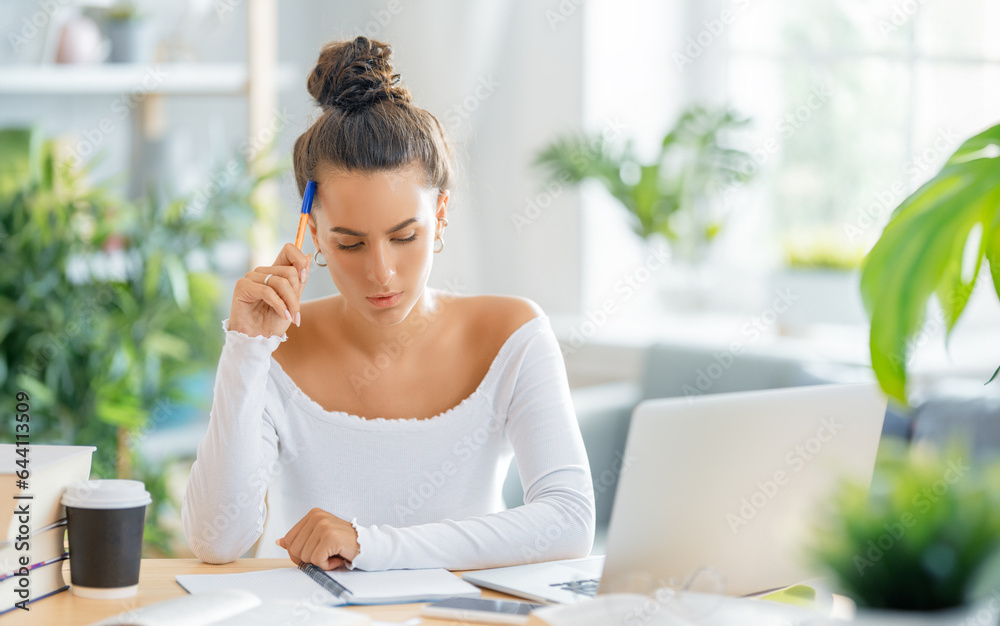 woman working on laptop at home