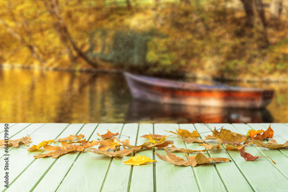 Beautiful autumn leaves on wooden table outdoors