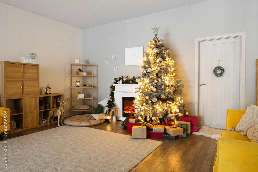 Interior of living room with fireplace, Christmas tree and gifts