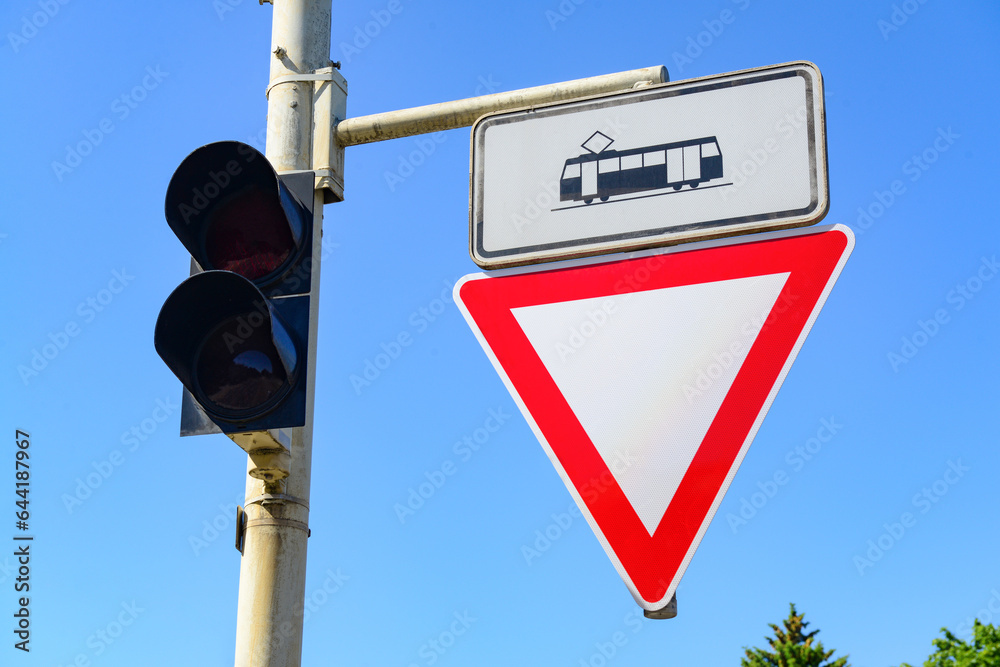 View of traffic lights with road signs in city, closeup