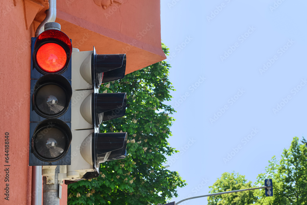 View of red traffic light in city, closeup