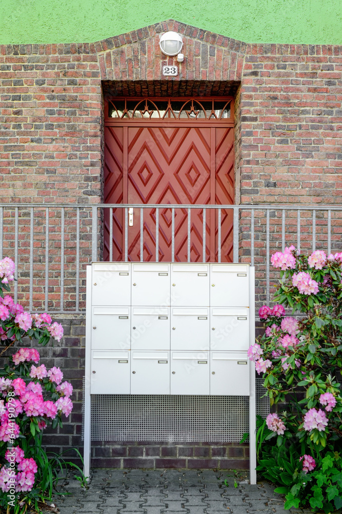 View of mailboxes and flowers near building