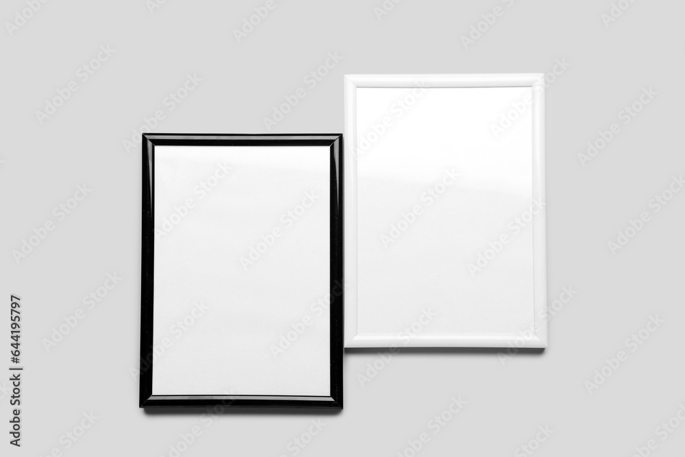 Blank picture frames on light background