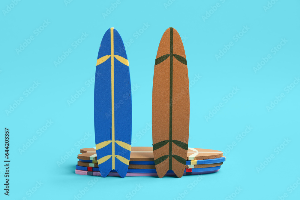 Different mini surfboards on blue background