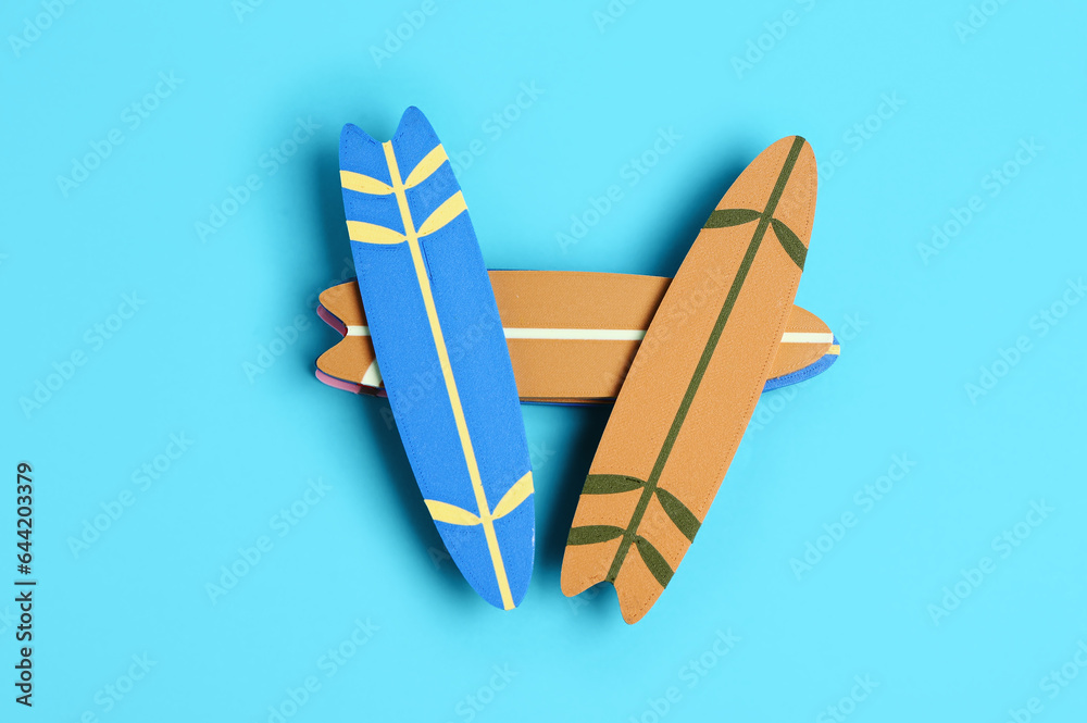 Different mini surfboards on blue background