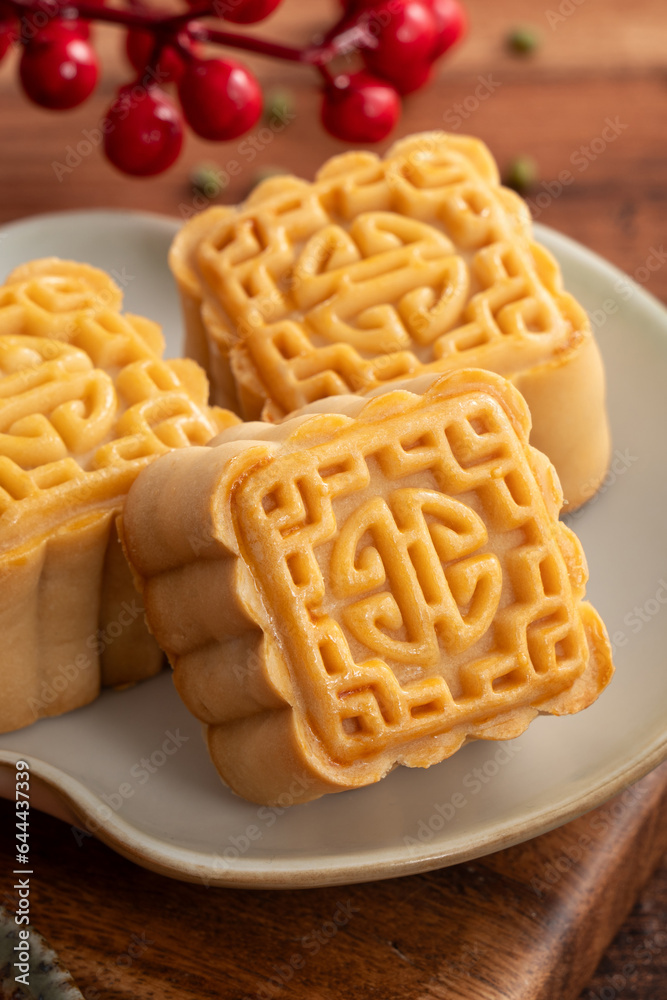 Delicious Cantonese moon cake for Mid-Autumn Festival food mooncake on wooden table background.