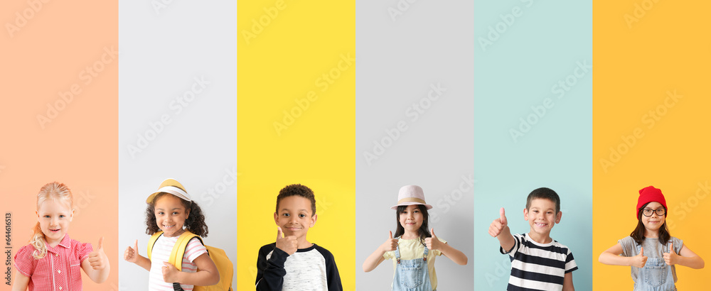 Collage of happy little children showing thumb-up gesture on color background