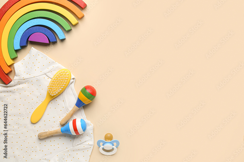 Composition with baby toys, clothes and accessories on color background