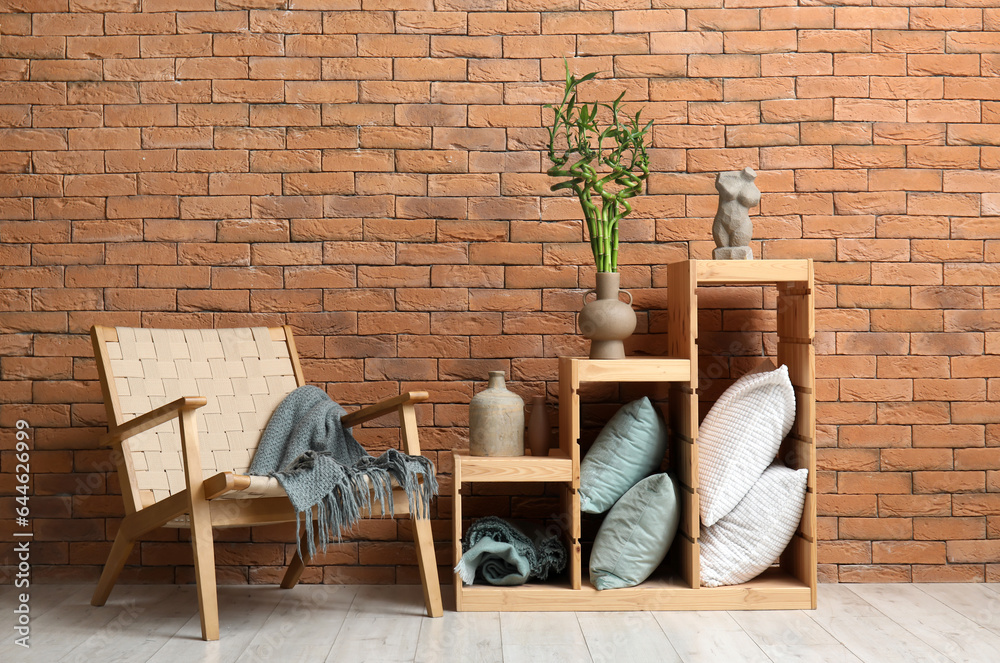 Vase with green bamboo branches in interior of living room